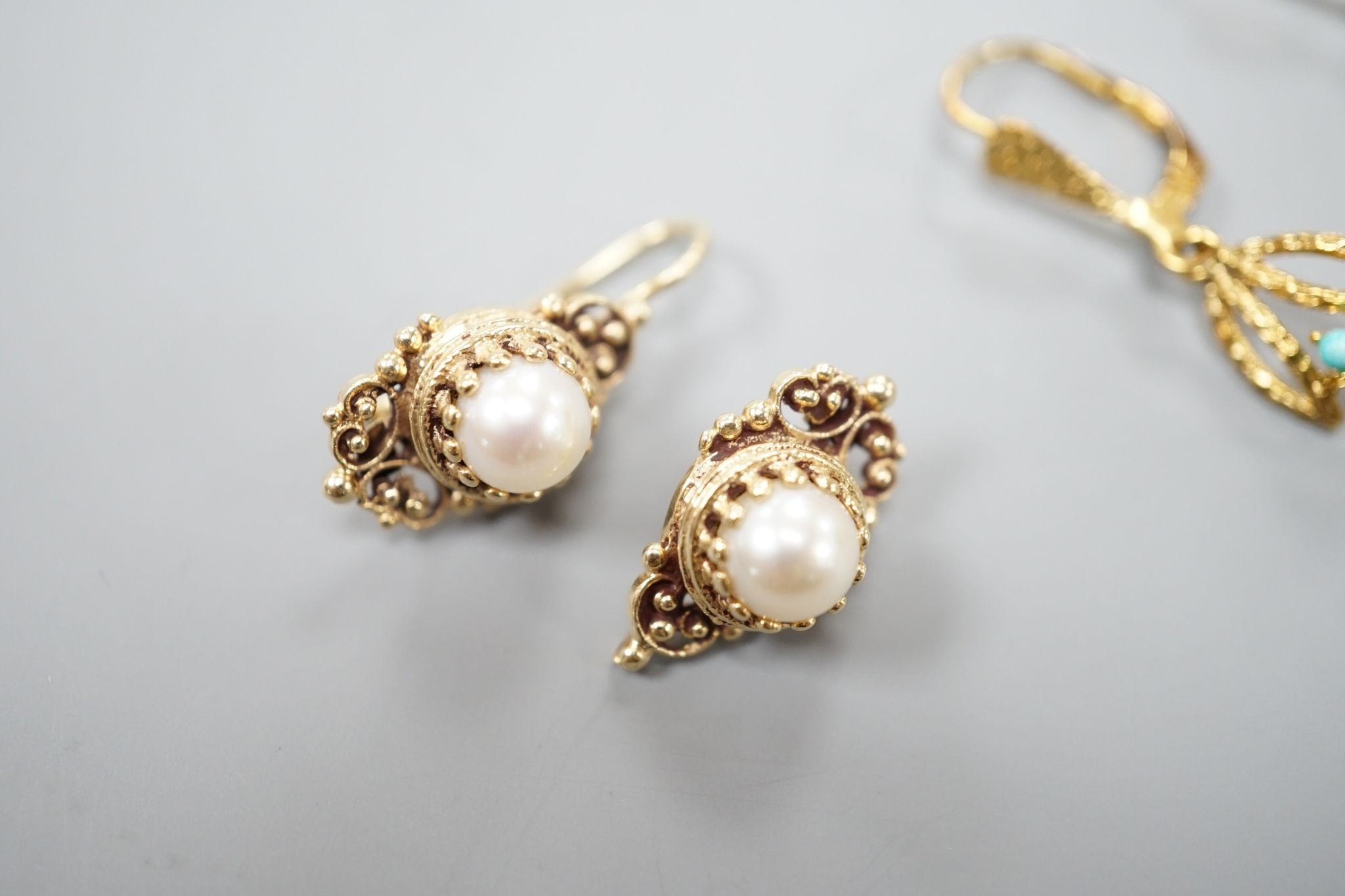 Two modern pairs of 14ct and gem set earrings, one with mabe pearl (a.f.) and one with turquoise, gross weight 7.1 grams.